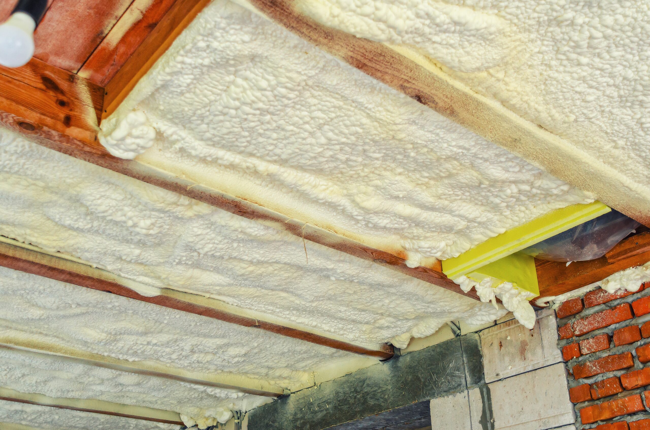 Insulation,Of,The,Ceiling,In,The,House,With,Polyurethane,Foam. spray foam in a crawl space